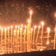 Lit candles at Ostrog Monastery - meanderbug