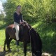 Riding horseback in a village in Montenegro