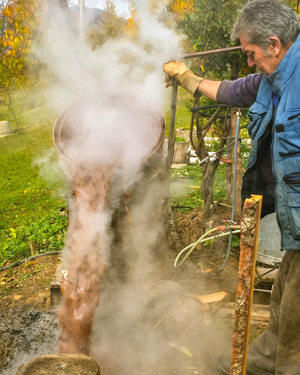 making rakija (fruit brandy) in the village in Northern Montenegro