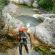 Rope belaying during a canyoning adventure in Montenegro