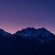 Purple sunsets over snowy mountains