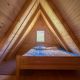 Double bed in wooden family farm stay in Montenegro