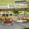 Farm to table organic foods served outdoors on wooden table